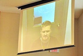 ['Gary Kean/The Western Star<br />Ashley Shannon Park of Corner Brook appeared via video from Her Majesty’s Penitentiary in St. John’s for his provincial court appearance in Corner Brook on armed robbery-related charges Tuesday.']