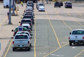 Passengers wait in line to board Marine Atlantic’s MV Blue Puttees for Friday’s morning crossing to Port axe Basques, N.L. More than 30 passenger vehicles boarded the vessel for the first official crossing since the Atlantic bubble opened early Friday morning. JEREMY FRASER/CAPE BRETON POST