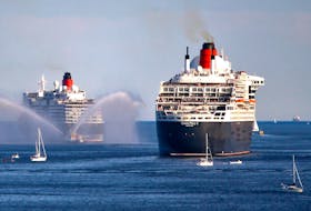 The Cunard vessels Queen Elizabeth, left, and Queen Mary 2 are feted with a water cannon last summer as they leave Halifax. - File