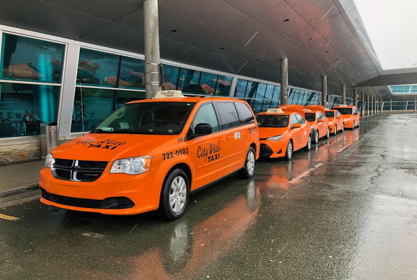 City Wide Cabs taxis wait outside St. John’s International Airport for passengers. — TELEGRAM FILE PHOTO