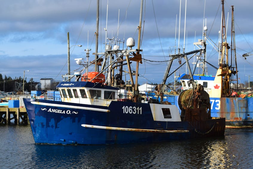 The fishing dragger Angela O steams into port at the Dennis Point wharf on Nov. 14 with the crew of the Atlantic Sapphire aboard