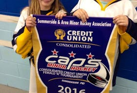 Ava Allain, left, and Ava MacGregor of the host East Prince Wildcats display the championship banner up for grabs at this weekend’s six-team atom A female hockey tournament at Credit Union Place. The two-day event is being hosted by the Summerside Area Minor Hockey Association. See schedule, page B2.