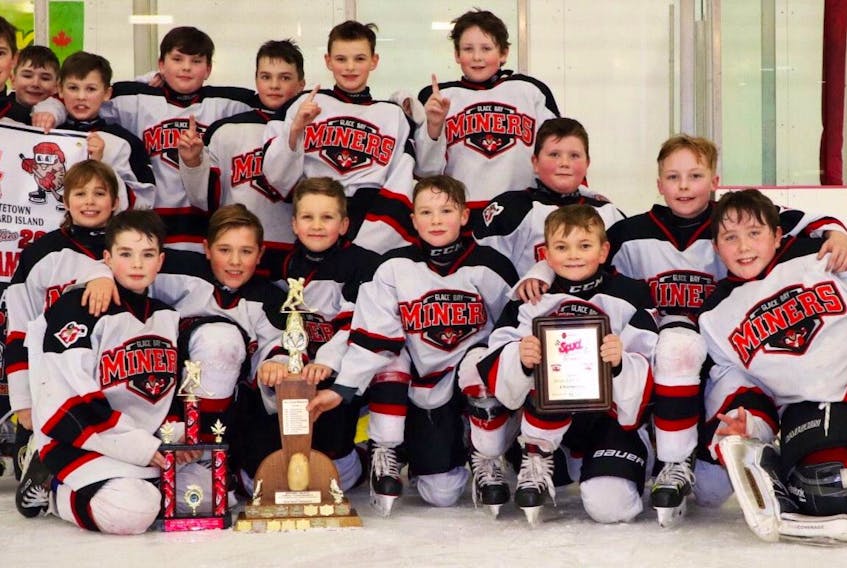 The Glace Bay Miners Atom 'AAA' hockey team captured the 45th annual Spud Tournament earlier this month with a 4-2 win over the Dartmouth Whalers at the MacLauchlan Arena in Charlottetown, P.E.I. Members of the team, with the championship trophy, include from left, front row, Nate Pheifer, Carter MacKenzie, Brighton Hardy, Grayson Sheaves, Tucker Sinclair, Deakin McPhee, Jordan O'Neill, Madden Gillis and Bryden Kelly; back row, Parker MacKenzie, Ashten Parker, Burke Aucoin, Sidney Pemberton, Owen Gracie, Lucas Chauder and Ryan White. CONTRIBUTED