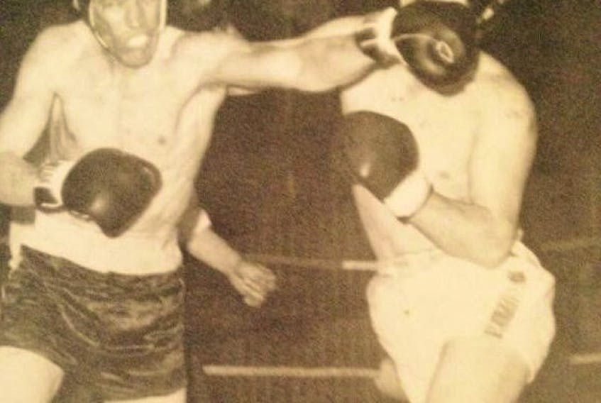 Old photo of Mike Coady,(l) throwing a punch