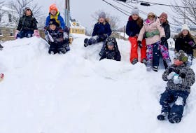 Kids enjoy fun in the snow in front of B.O.L.D's headquarters at the Kidston Landing building in Baddeck. CONTRIBUTED