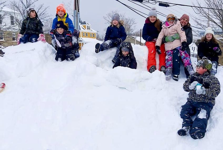 Kids enjoy fun in the snow in front of B.O.L.D's headquarters at the Kidston Landing building in Baddeck. CONTRIBUTED