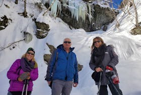 Wenda DeYoung, from left, Michael Haley and Karen Haley pose for a photo at Uisge Ban Falls Provincial Park Feb. 15. Two days later, a man was airlifted after he slipped into the water while trying to help a woman who had fallen through ice at the base of the 16-metre waterfall. Contributed/ Wenda DeYoung