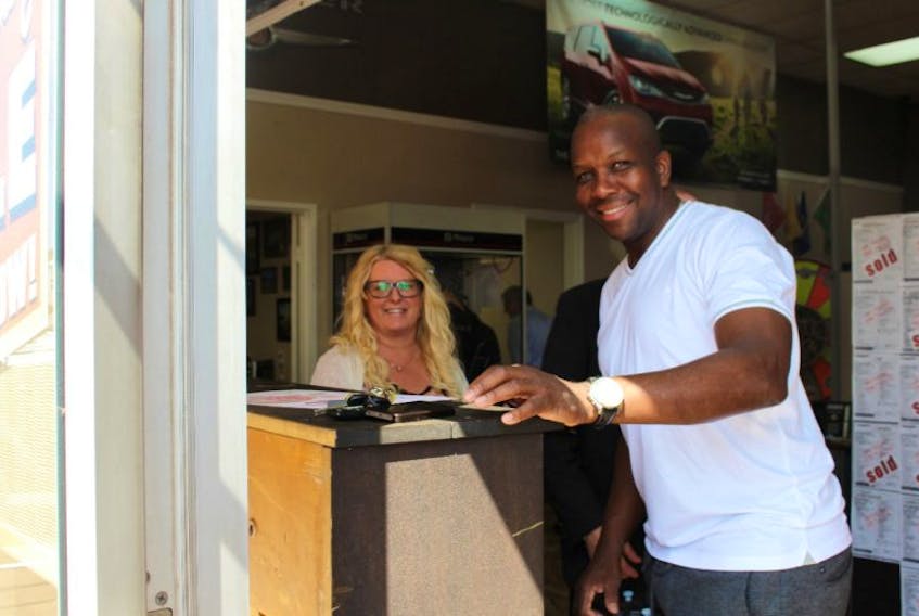 Olympic sprinter Donovan Bailey and Sheila Bell of Summerside Chrysler Dodge