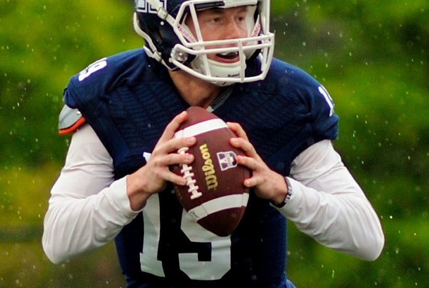 Bailey Wasdal, a first-year X-Men quarterback, readies for a pass during pre-season action versus the Acadia Axemen. The Calgary native has been the early season starter for the Blue and White. Bryan Kennedy
