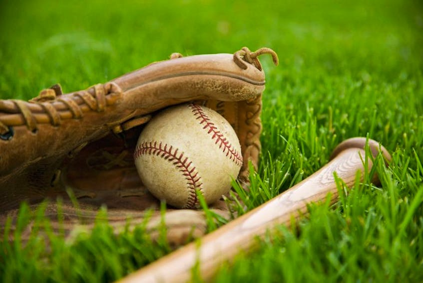 Baseball Equipment Laying on Grass --- Image by © Royalty-Free/Corbis