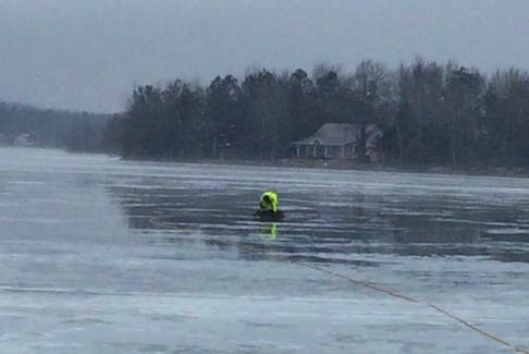 Rob Bezanson, deputy chief of Brookfield Fire and Emergency Services, crawled out on the ice of Shortts Lake March 2 to rescue a small doe that had fallen and couldn’t get up.