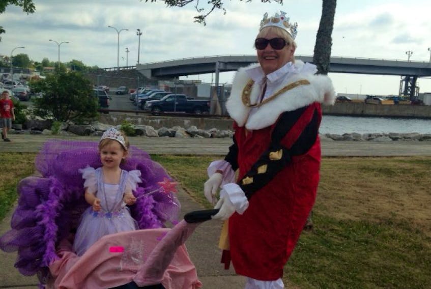 Brielle McBurnie, and grandmother Roberta McBurnie (her trusty footman), were just one of many participants in the Bartown Festival's doll carriage and bicycle parade on Thursday, July 24.