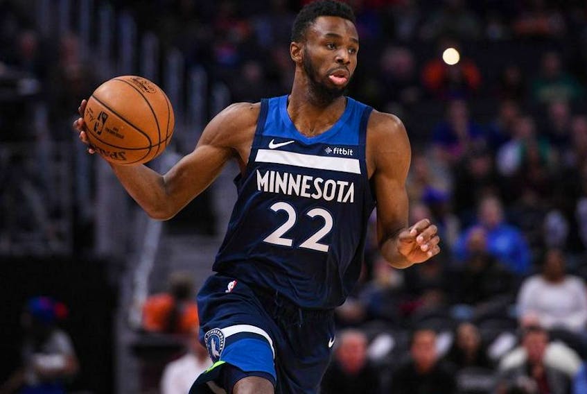 Minnesota Timberwolves guard Andrew Wiggins brings the ball up court during the first quarter against the Detroit Pistons at Little Caesars Arena. 