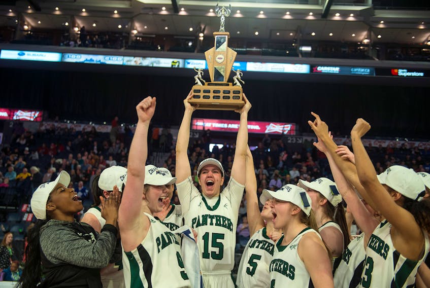  Prince Edward Island Panthers centre Carolina Del Santo hoists the AUS women's basketball championship  trophy after the Panthers beat Acadia 78-59 in Sunday’s  final. Ryan Taplin - The Chronicle Herald