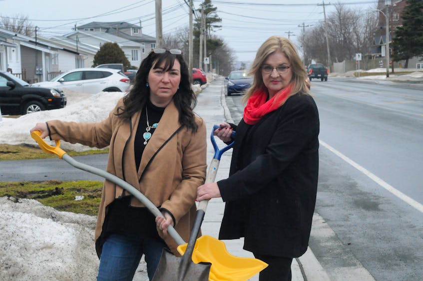 Bay Bulls Road residents Victoria Blagdon (left) and Dolores Hutton are digging in their heels to fight St. John’s City Hall over bills they received for infrastructure work done in their Kilbride neighbourhood. The two are shown outside their homes Saturday before meeting later in the day with other area residents with similar concerns.  — Joe Gibbons/The Telegram
