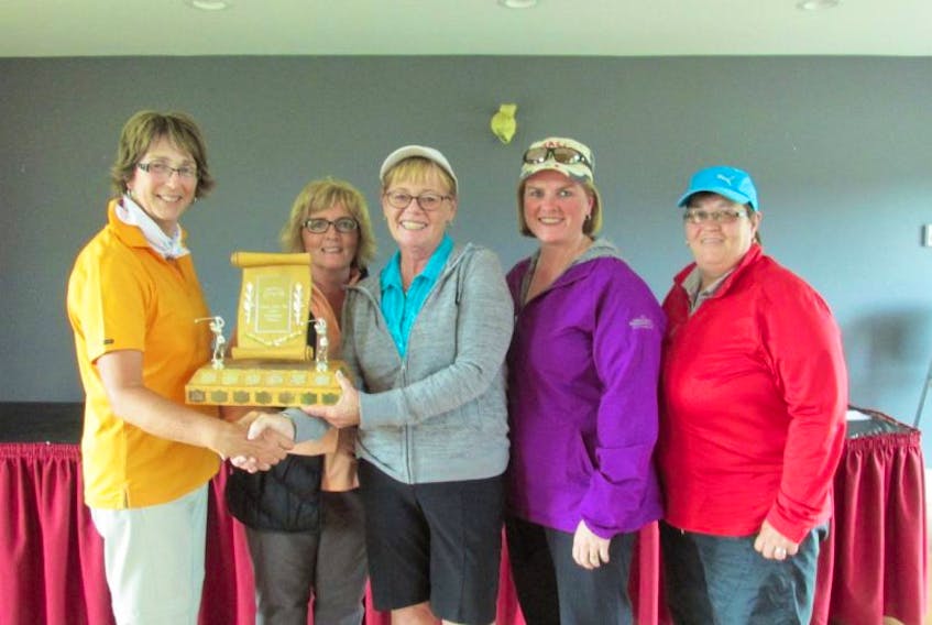 Event chairwoman Nancy Dawe (far left) presented members of the Glendenning golf course in St. John’s with a trophy for winning the Gander Golf Club’s ladies invitational golf tournament. The winners were Kathleen O’Brien, Christine Hamlyn, Elizabeth Williams and Kendra Constantine.

