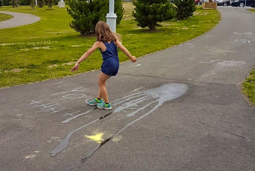 While on a family fun day to Cobb’s Pond Rotary Park in Gander, a Musgrave Harbour family came across a series of derogatory words drawn in chalk along the walkway. The family took it upon themselves to clean it up.