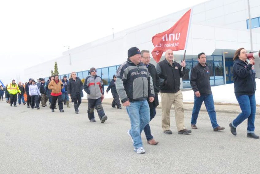 At a rally to support 31 locked out employees in Gander on April 20, demonstrators marched along the property of D-J Composites.