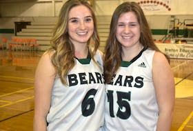 Breton Education Centre Bears players Abby MacNeil, left, and Kelsie Neville pose for a photo following team practice at the BEC gym on Friday. The girls’ team will play two games at the New Waterford Coal Bowl Classic, beginning Tuesday evening. JEREMY FRASER/CAPE BRETON POST