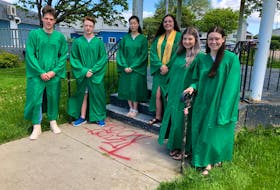 Breton Education Centre graduates gathered at William Davis Square in New Waterford for a photo on Tuesday. They will end the week with the drive-in grand march on Sunday. From left, Matthew Ross, Kyle MacKenzie, Megumi Furukawa, Vessa MacNeil, Rennee Doucette and Madison Bresowan. NICOLE SULLIVAN/CAPE BRETON POST 