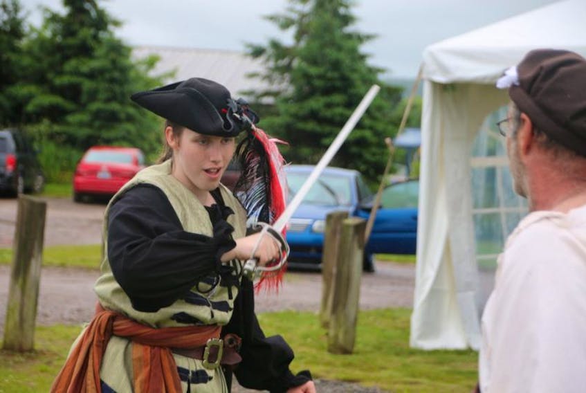 Suzanne Atkinson appeared to be taking things quite seriously when she joined in a ‘sword fight’ with her father, Bill, during celebrations in Bible Hill. They will be taking part in the Colchester Highland Games and Gathering in September.