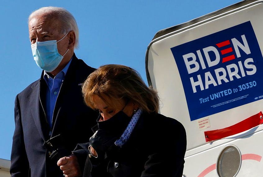  Democratic U.S. presidential nominee and former vice-president Joe Biden, accompanied by his sister Valerie, arrives at the airport to campaign in Des Moines, Iowa, on Oct. 30, 2020.