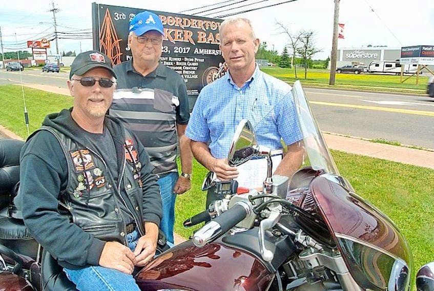 Peter Rushton (front), John Warner and Mike Johnson are busy preparing for the Third Bordertown Biker Bash from July 21 to 23 at the Amherst Town Square Mall and NSCC Amherst parking lot. 