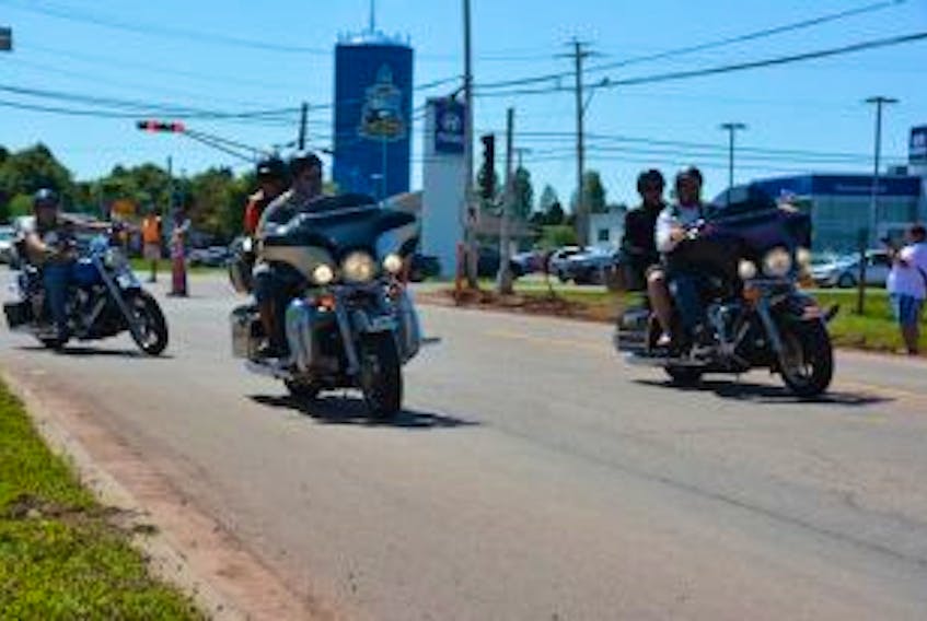 ['Motorcycles depart the Salvation Army Church in Summerside on Sunday before driving 100 kilometers across the county as part of the Yvette Arsenault and Paul MacLean Memorial Ride. Brett Poirier / Journal Pioneer']
