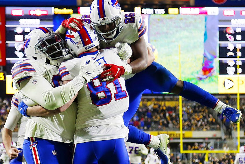 Tyler Kroft (81) of the Buffalo Bills celebrates with teammates after scoring a touchdown against the Pittsburgh Steelers at Heinz Field on December 15, 2019 in Pittsburgh. (Justin K. Aller/Getty Images)
