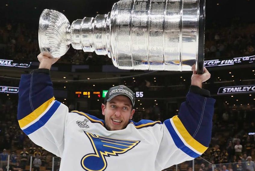 St. Louis Blues goalie Jordan Binnington celebrates with the Stanley Cup in June. GETTY IMAGES