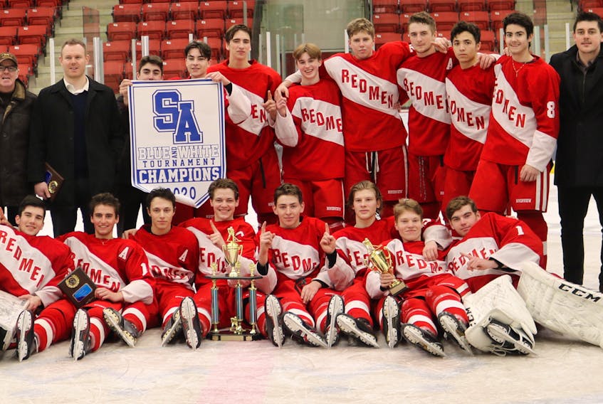 The Riverview Redmen captured the Blue and White Contractor Cup on Jan. 12, blanking the Dartmouth Spartans 3-0 in the championship game of the Sydney Academy-hosted high school hockey tournament at the Membertou Sport and Wellness Centre. Members of the team are pictured with the championship trophy and banner. Front row, from left, Liam Robertson, Josh Leudy, Trevor Jennings, Kendall MacQueen, Ethan Stanwick, Josh MacAskill, Chase Sampson, Bryce MacKenzie and Michael MacMullen. Back row, from left, Michael Florian, Brendan Smith, Jordan Moss (assistant coach), Danny MacDougall, Steve Jamael (assistant coach), Sam MacKinnon, Noah MacKinnon Curtis Novak, Owen Burke, Rylan MacIntyre, A.J. Ley, Nathaniel Fuller, Brady Lavin, Daniel Keough (assistant coach), Rory Morrison, Ian Hennebury and Jimmy Smith (head coach). CONTRIBUTED/JEAN STANWICK.