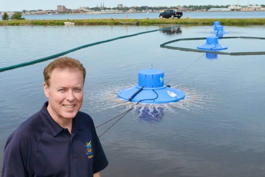 Stratford Mayor David Dunphy shows off some of the town's new Blue Frog units at the sewage lagoon.