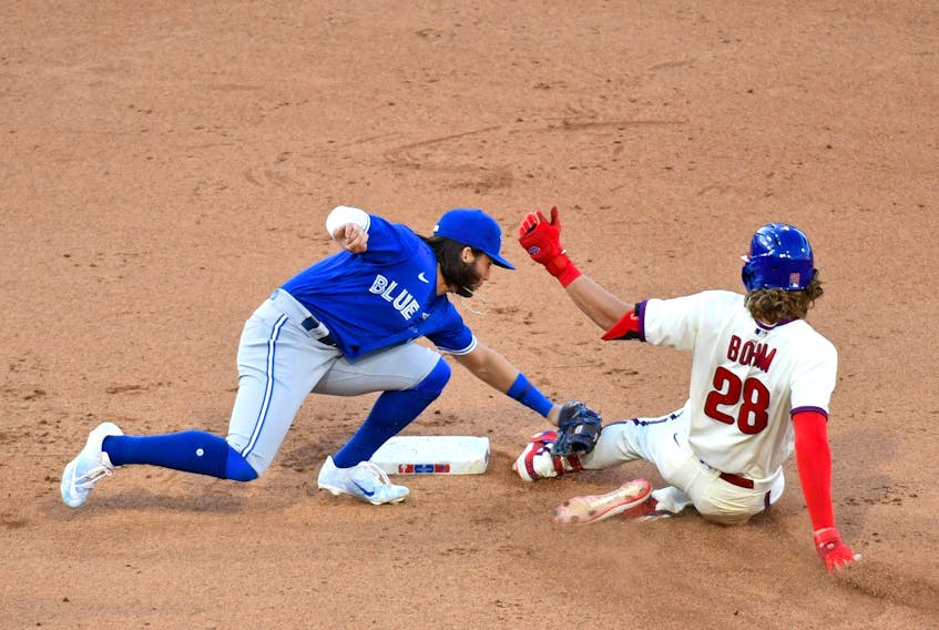 Toronto Blue Jays shortstop Bo Bichette (11) tags out Philadelphia Phillies third baseman Alec Bohm during the seventh inning at Citizens Bank Park on Sunday.