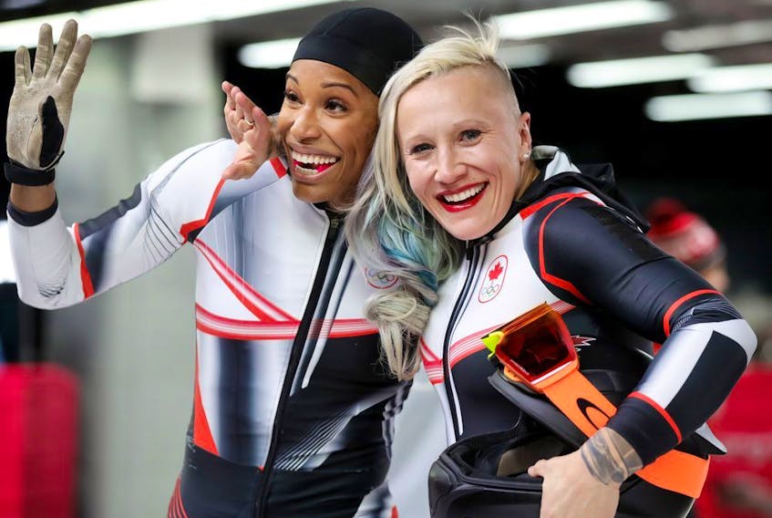 Canada's Kaillie Humphries and Phylicia George celebrate their final run at the Pyeongchang Olympics on Feb. 21.