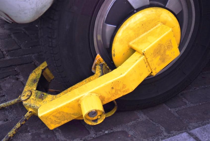 RFM Parking begins its work in St. John’s Tuesday. People parked illegally in lots monitored by the company will find their vehicle immobilized with a yellow boot.