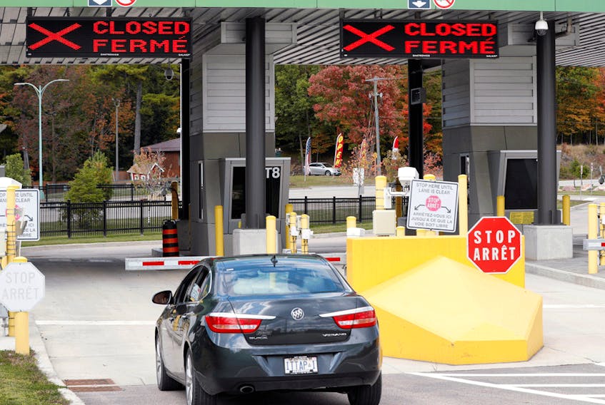 A car waits to enter a checkpoint to enter Canada at the Canada-United States border crossing in Lansdowne, Ontario, on September 28, 2020.