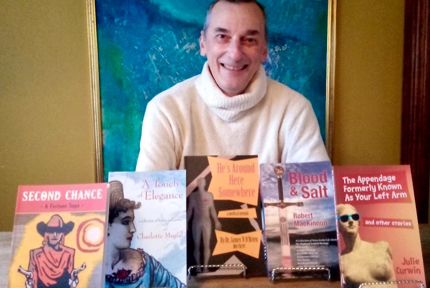 Author and publisher Douglas Arthur Brown shows the five most recent books to be published by his company, Boularderie Island Press. CONTRIBUTED LARS WILLUM