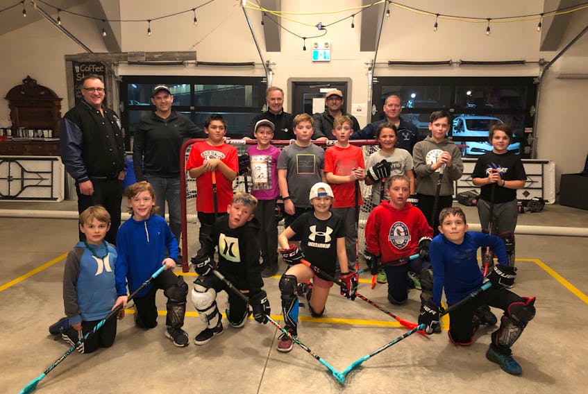 The minor hockey team tries out floorball for the first time at the Farm and Market in Clarenville.