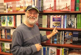 Lester Green with his book at the Chapters book store in St. John’s. CONTRIBUTED
