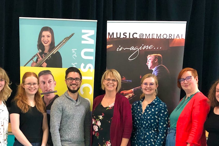 James Paluk, program manager of Giocoso: Teaching Artists of NL, poses with Clarenville music teacher Ann Lundrigan and the six MUN music students at the program launch on Friday, Oct. 4.