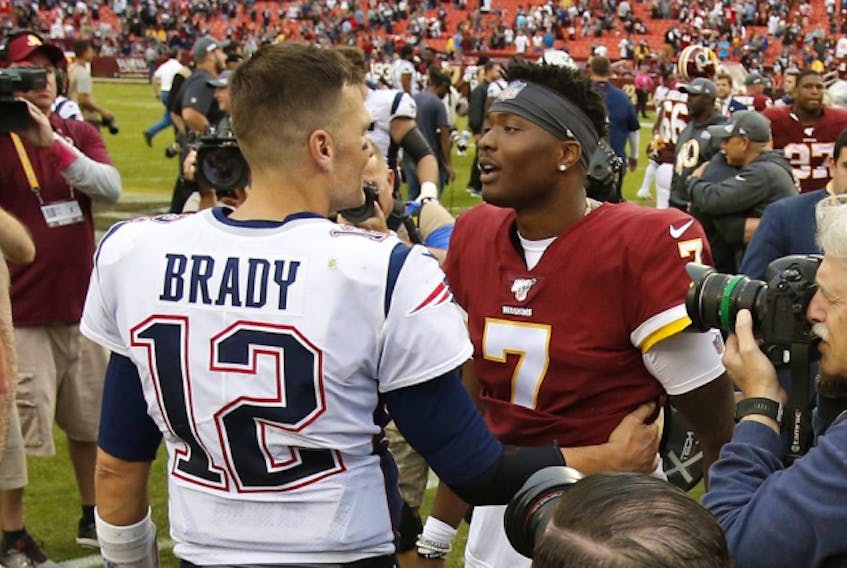  Patriots quarterback Tom Brady (12) greets Redskins quarterback Dwayne Haskins (7) after their game at FedExField in Landover, Maryland, on Sunday, Oct. 6, 2019.