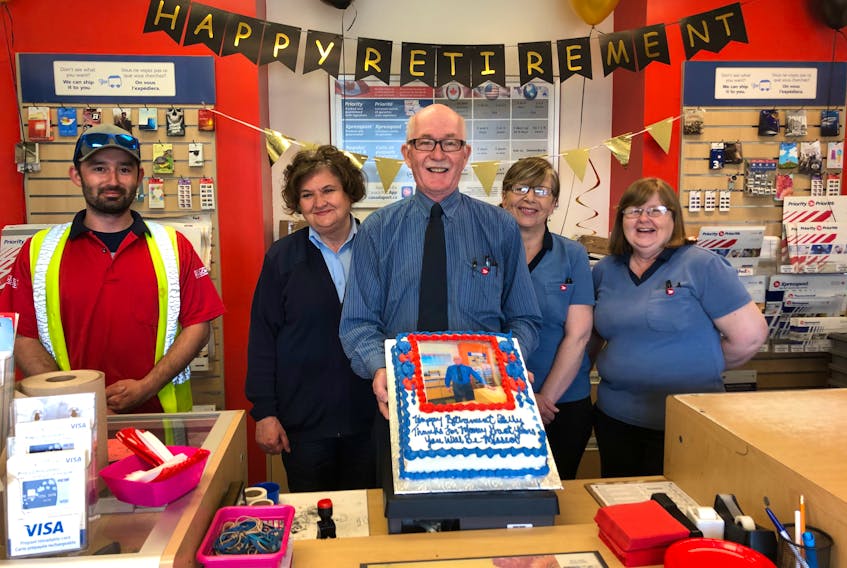 William (Billy) Brennick, centre, shows off his retirement cake on his last day at Bras d'Or Post Office on May 29. Over his 43-year career, Brennick has witnessed many changes and said he'll miss the customers and co-workers. From left, Tyler Leyte, Kathy Edwards, Nancy LeBlanc and Mabel Ivey. CONTRIBUTED