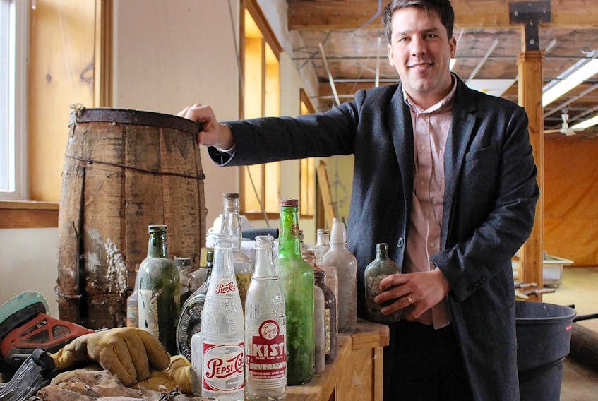 Alex Clark, co-owner of a soon to be microbrewery in Summerside, says countless old liquor and other drink bottles were found in the dirt floor of the former train-station turned library. Currently, the building on Water Street in Summerside is being renovated into a microbrewery.  MILLICENT MCKAY/JOURNAL PIONEER