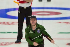 Tyler Smith of Team P.E.I. yells instructions to his sweepers during Wednesday’s round-robing game against Team Canada's Brad Gushue rink at the 2021 Tim Hortons Brier in Calgary. Smith moved up from the third position to skip the game. Team Canada won the game 8-4.