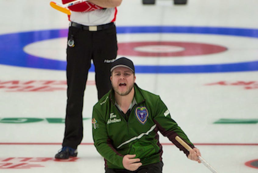 Tyler Smith of Team P.E.I. yells instructions to his sweepers during Wednesday’s round-robing game against Team Canada's Brad Gushue rink at the 2021 Tim Hortons Brier in Calgary. Smith moved up from the third position to skip the game. Team Canada won the game 8-4.