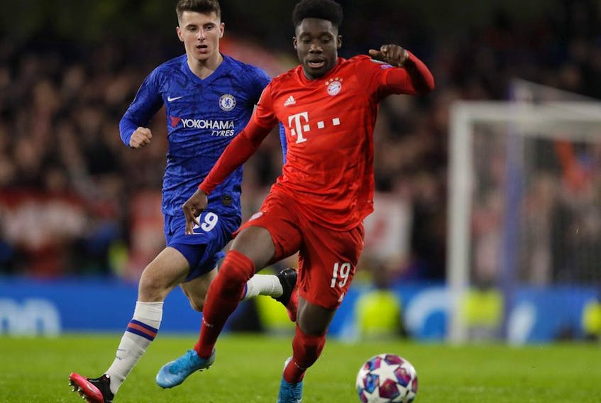 Bayern's Alphonso Davies, right, is challenged by Chelsea's Mason Mount during a first leg, round of 16, Champions League soccer match between Chelsea and Bayern Munich at Stamford Bridge stadium in London, England on Tuesday, Feb. 25.