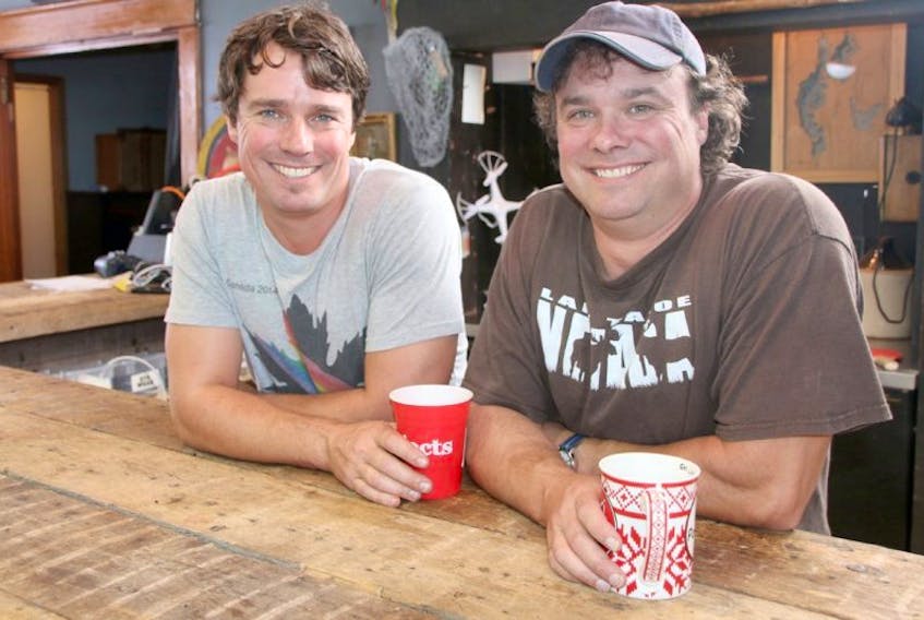 Andrew, left, and Kevin Buckles take a break during filming of for Season 2 of “Brojects: In the House.” The bar was one of the projects completed last year, for Season 1.