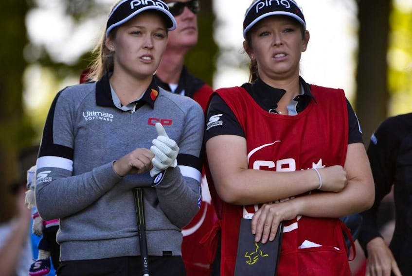 Brooke Henderson, left, with her caddie and sister Brittany Henderson on the second hole tee box during the first round of the CP Women's Open at Magna Golf Club in Aurora, Ont., on Thursday, Aug 22, 2019.