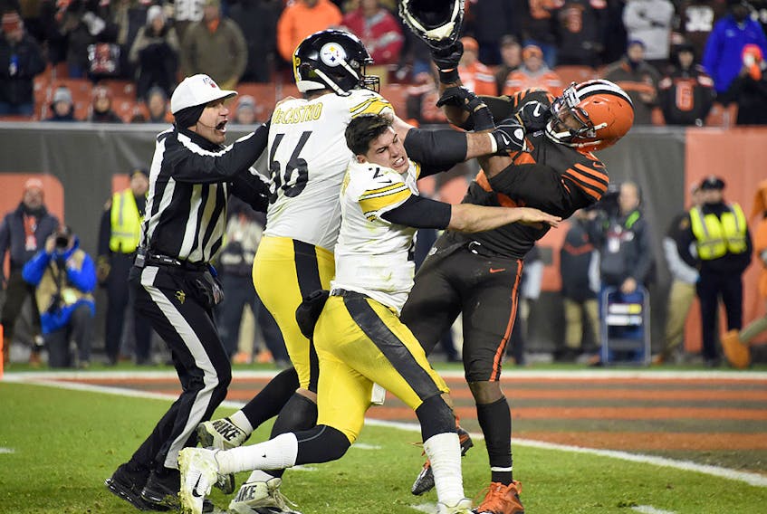 Quarterback Mason Rudolph of the Pittsburgh Steelers fights with defensive end Myles Garrett of the Cleveland Browns at FirstEnergy Stadium on November 14, 2019 in Cleveland.  (Jason Miller/Getty Images)