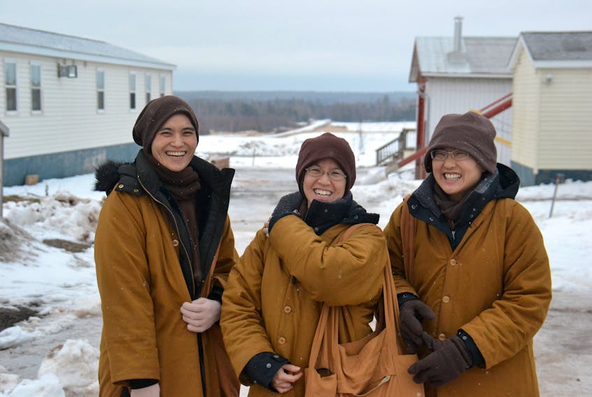Venerables, from left, Yvonne Tsai, Joanna Ho and Sabrina Chiang at the Uigg monastery site in January 2020. The three board members of Great Wisdom Buddhist Institute say the organization is facing increasing pressures to find housing.